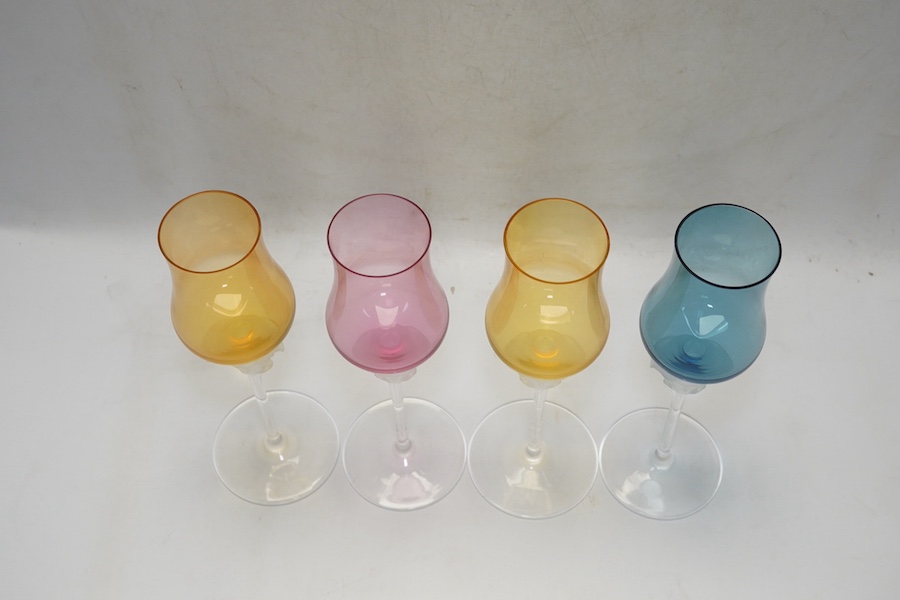 Four boxed Rosenthal for Versace Medusa head grappa glasses in various colours, 21.5cm high. Condition - good.